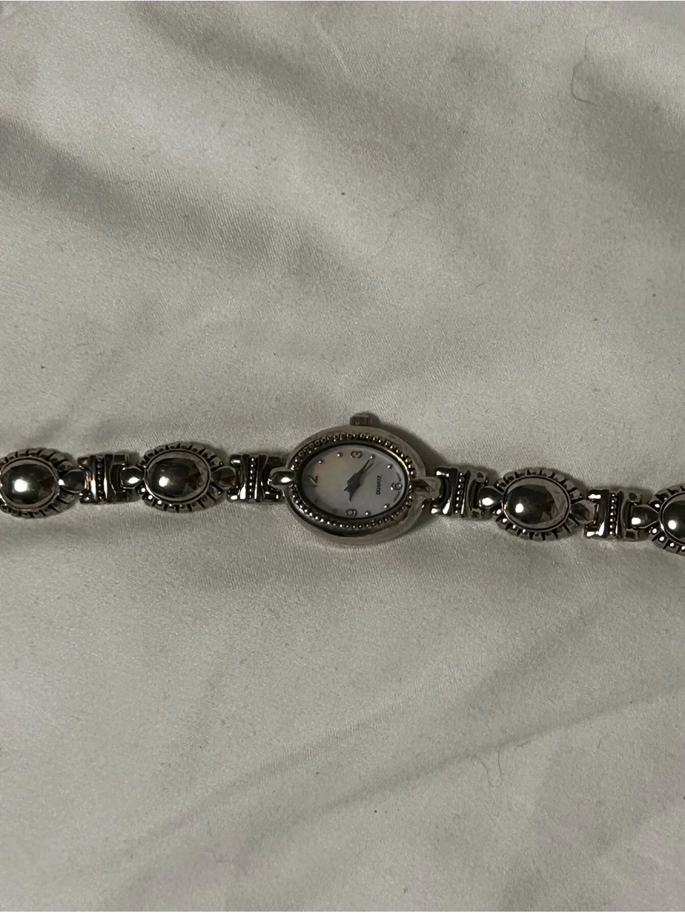 Silver Oval Bracelet Watch with Decorative Links